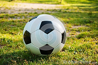 Soccer ball on penalty spot in natural football ground Stock Photo