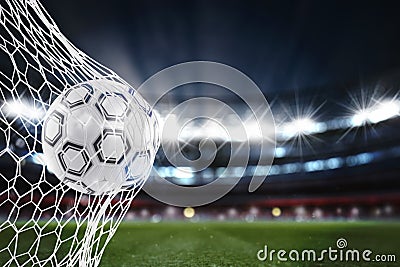 Soccer ball scores a goal on the net. 3D Rendering Stock Photo