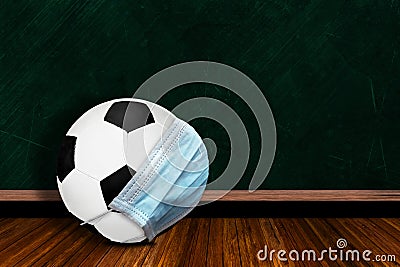 Soccer Ball Wearing Mask With Chalkboard Background and Copy Space Stock Photo