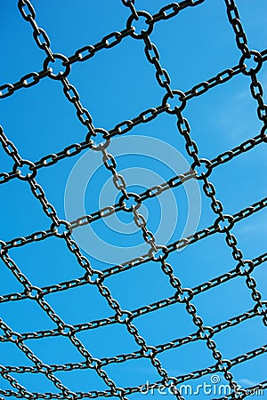 Soccer cage goal, blue sky, net grid imprisoned Stock Photo