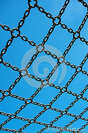 Soccer cage goal, blue sky, net grid imprisoned Stock Photo