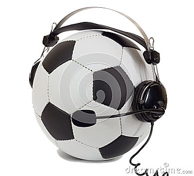 Soccer concept, ball in headphones as commentator Stock Photo