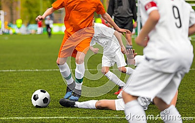 Soccer Duel. Young Running Players Competing for the Soccer Ball Stock Photo