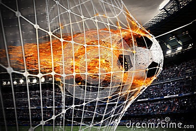 Soccer fireball scores a goal on the net Stock Photo