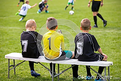 Soccer Football Bench. Young Footballers Sitting on Football Substitute Bench. Editorial Stock Photo