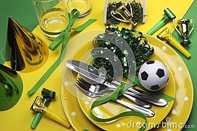 Soccer football celebration party table settings in yellow and green Stock Photo