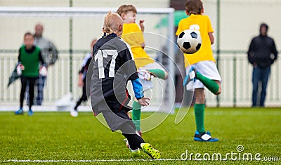 Soccer Football Match. Single Player Kick off. Kids Playing Soccer. Young Boys Kicking Football Ball Editorial Stock Photo