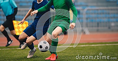 Soccer football players competing for ball and kick ball during match in the stadium Stock Photo