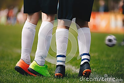 Soccer free kick wall - close up of players legs. Two young football players standing in wall during free kick Stock Photo