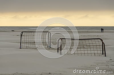 Soccer goals on a beach at sunset Stock Photo