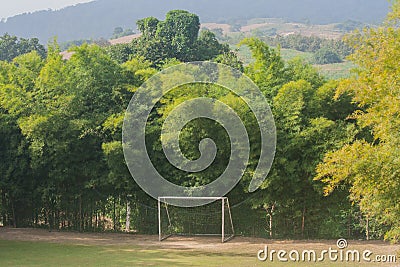 Soccer goals with trees surrounded it. Stock Photo