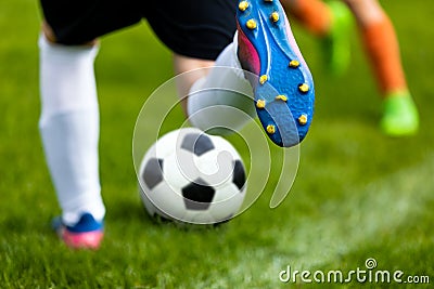 Soccer Kick. Footballer Kicking Ball on Grass Pitch. Football Soccer Player Hits a Ball Stock Photo