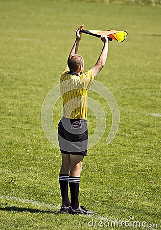 Soccer official with flag Stock Photo