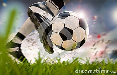 Soccer player kicking soccer ball in motion Stock Photo