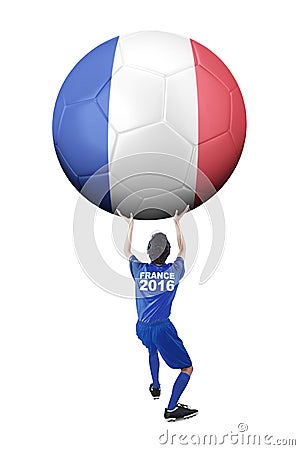 Soccer player lifts ball with flag of France Stock Photo