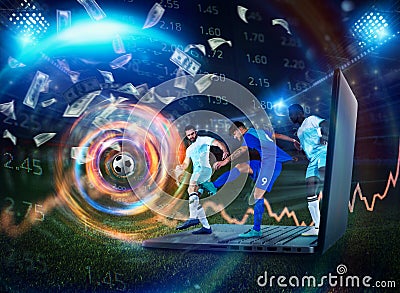 Soccer player play on a laptop concept of football online betting Stock Photo