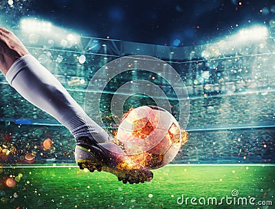 Soccer player with soccerball on fire at the stadium during the match Stock Photo