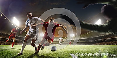 Soccer players in action on sunset stadium background panorama Stock Photo