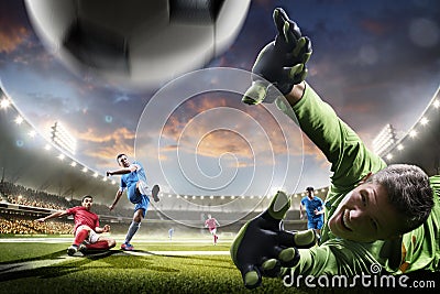 Soccer players in action on sunset stadium background panorama Stock Photo