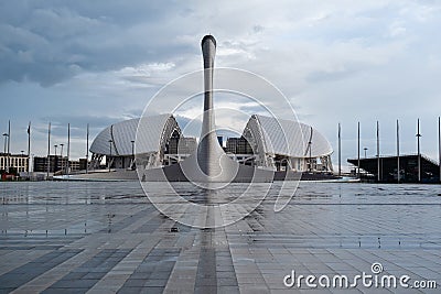 SOCHI, ADLER, RUSSIA, April 13, 2023: Olympic Torch and stadium Fisht in Olympic park, front view Editorial Stock Photo