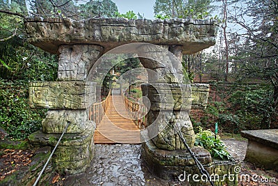 Tiled dolmen and bridge in the Upper Park in the Arboretum in Sochi city, Russia Stock Photo