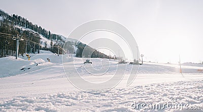 Ski slope Rosa Khutor with snowcats during the preparation of tracks for skiers and snowboarders. Stock Photo