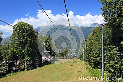 Tourists ride the cable car in the Caucasus mountains near the r Editorial Stock Photo