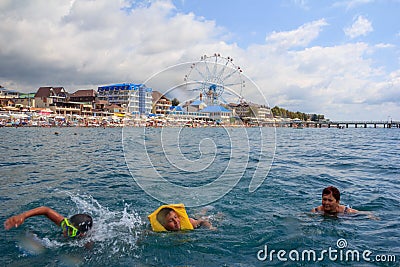 teenage boys and grandma swim in the sea Editorial Stock Photo