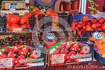 Sochi, Russia - July 26, 2008: Various ripe fresh fruits and berries sell at a street market. Shopdoard view Editorial Stock Photo