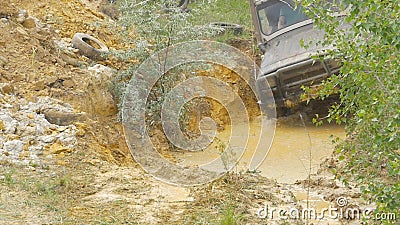 Sochi, Russia 5 June: Car wheel on a dirt road. Off-road tire covered with mud, dirt terrain. Outdoor, adventures and Editorial Stock Photo