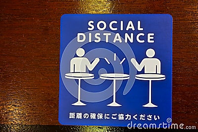 Social Distance word sticker on the table Stock Photo