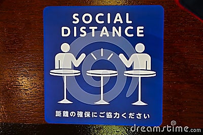 Social Distance word sticker on the table Stock Photo