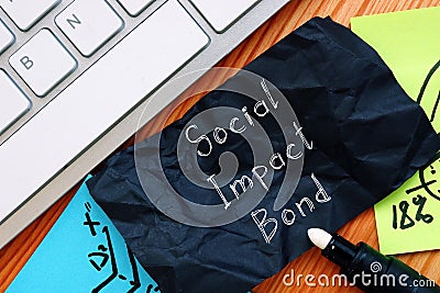 Social Impact Bond phrase on the sheet Stock Photo