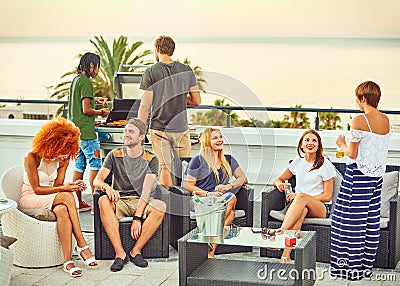 Social interaction amongst an attractive group of frineds during barbecue Stock Photo