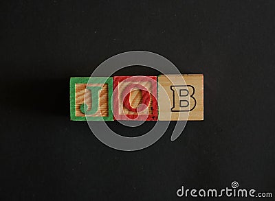 Word Jobs composed by wooden cubes on black background Stock Photo