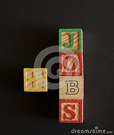 Word Jobs composed by wooden cubes on black background Stock Photo