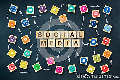 Social media concept with social icons on wooden blocks. Dark blue background.C Stock Photo