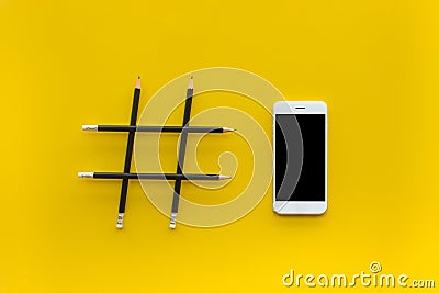Social media and creativity concepts with Hashtag sign made of pencil and smartphone Stock Photo