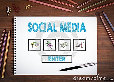 Social Media. Notebooks, pen and colored pencils on a wooden table Stock Photo