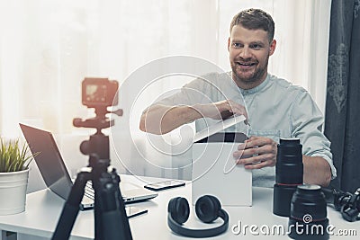 social media technology influencer recording unboxing video Stock Photo