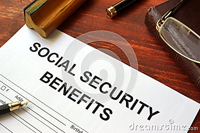 Social security benefits form and glasses. Stock Photo