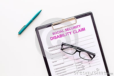 Social security. Disability claim form near glasses on white background top view space for text Stock Photo