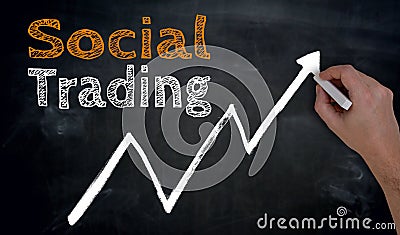 Social trading is written by hand on blackboard Stock Photo