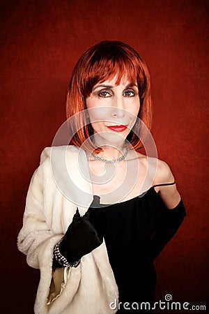 Socialite with brassy red hair Stock Photo