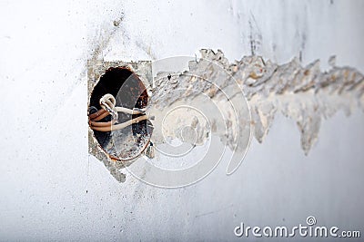 A socket outlet with exposed aluminum wires. Wiring repair concept Stock Photo