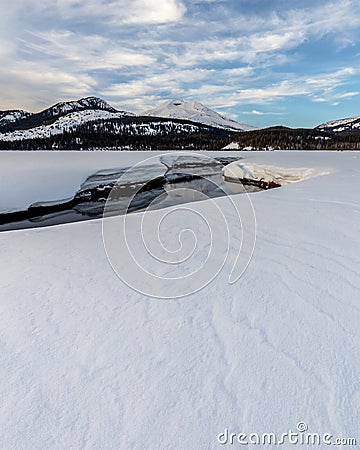 Soda Creek Meanders through a Snow Covered Meadow in Deschutes N Stock Photo