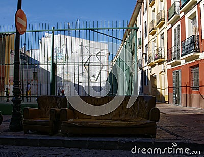 Sofa and armchair left on the street. Stock Photo