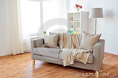 Sofa with cushions at cozy home living room Stock Photo