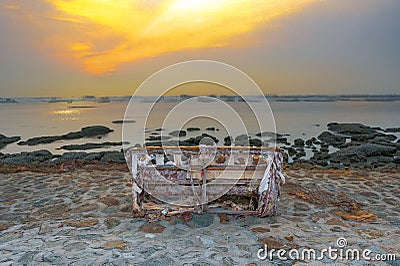 SOFA ON THE SHORE Stock Photo