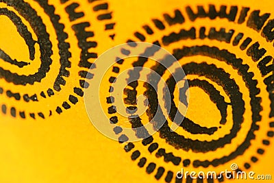 Sofia, Bulgaria - April 17, 2015: Closeup macro image shot of illustrated black spiral patterns on orange background Editorial Stock Photo